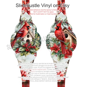 May include: Hourglass-shaped vinyl decal for epoxy tumblers. The design features a red cardinal bird perched near a birdhouse, surrounded by red poinsettias and winter foliage. The decal measures 10.5 inches tall and 3 inches at its widest point.