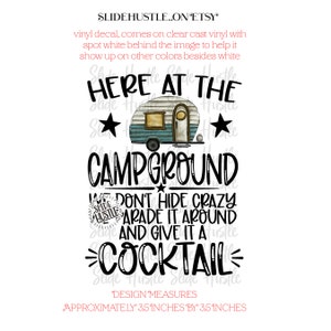 May include: A black and white graphic design with a camper van, stars, and the text "Here at the Campground We Don't Hide Crazy Parade It Around And Give It A Cocktail".
