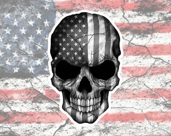 May include: A black and white skull with an American flag design. The skull is cracked and weathered, giving it a distressed look.