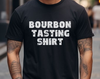 May include: Black t-shirt with white text that reads "Bourbon Tasting Shirt".
