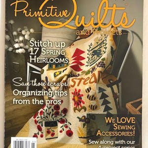 May include: A magazine cover for "Primitive Quilts and Projects" Spring 2019. The cover features a colorful quilt draped over a chair. Text includes "Stitch up 17 Spring Heirlooms" and "We Love Sewing Accessories!"