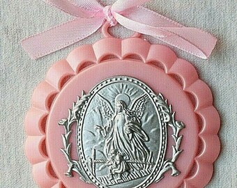 Protection for babies. Little crib medal hand embroidered