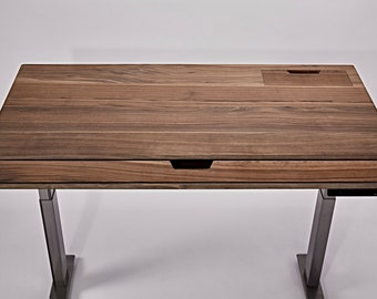 May include: A wooden standing desk with a drawer and a small compartment on the top. The desk has a dark brown wood finish and black metal legs.