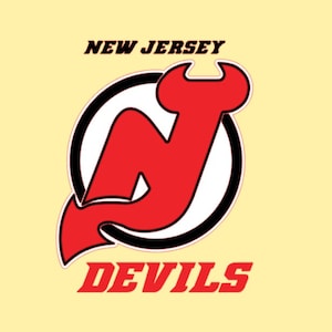 May include: The New Jersey Devils logo displays a red "N" with a devil's tail, enclosed in a black and white circle. The words "NEW JERSEY" and "DEVILS" are printed above and below the logo in red, set against a light yellow background.