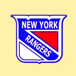 May include: A blue and white logo with the words "New York Rangers" in white lettering. The logo is shaped like a shield with a red triangle in the center.