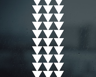 May include: A white Hawaiian pattern with a repeating design of white triangles on a dark background.