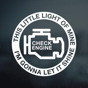 May include: White circle sticker with the text "This little light of mine I'm gonna let it shine" and a check engine light icon with the text "Check Engine" inside.