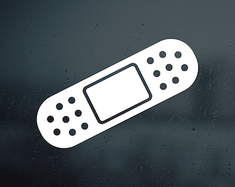 May include: White adhesive bandage sticker with a rectangular shape and a textured surface. The sticker has a white border and a white center with a rectangular cutout. The sticker has a row of small white circles along the top and bottom edges.