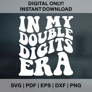 May include: White text on a dark background reads "In My Double Digits Era" in a retro, wavy font style.  This digital download includes SVG, PDF, EPS, DXF, and PNG file formats.