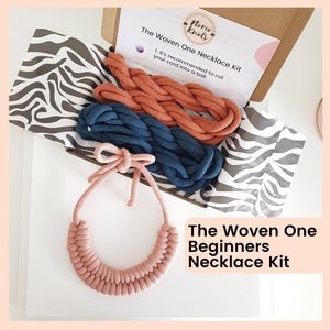 May include: A kit for making a woven necklace. The kit includes three spools of cord in pink, blue, and orange. The kit is packaged in a box with a white and black zebra print lining. The box has a label that reads "The Woven One Necklace Kit" and "Noris Knots".