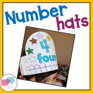 May include: A child wearing a white paper hat with the number four and the word "four" written on it. The hat is decorated with colourful stars and has a number line on the bottom.