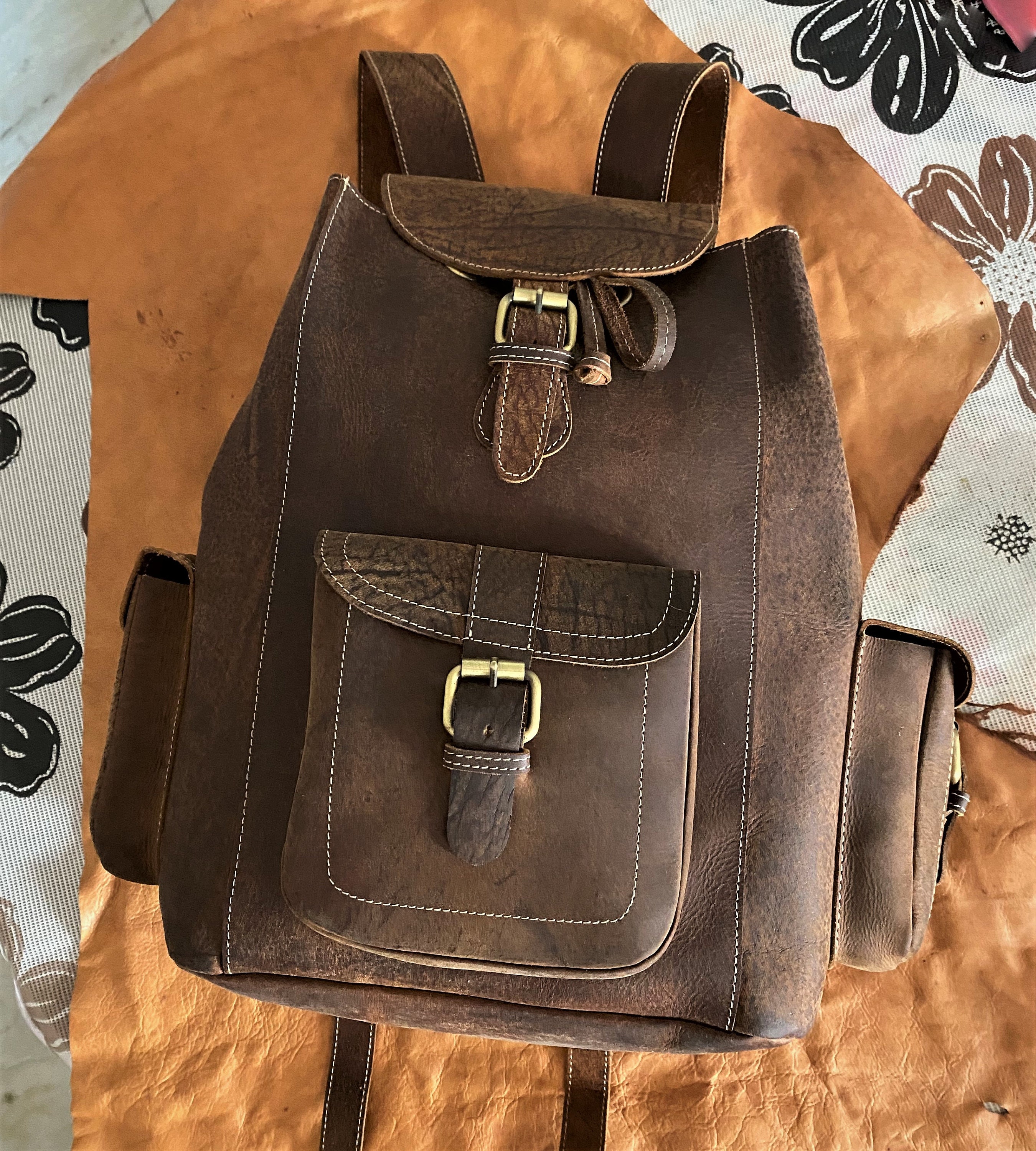 raw leather backpack