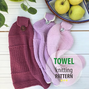 May include: Three knitted kitchen towels in shades of purple, each with a button closure. The towels are displayed on a white wooden surface, with a dish of yellow apples and a green plant in the background. The text "TOWEL knitting PATTERN" is visible.