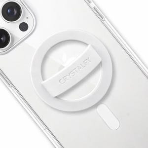 May include: A white phone grip with the word "CRYSTALFY" printed on it, attached to the back of a clear phone case. The grip is a circular design with a rectangular handle for holding the phone.