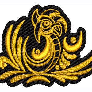 May include: A gold embroidered patch with a stylized bird design on a black background. The bird is surrounded by stylized floral elements.