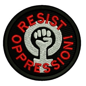May include: A black and red embroidered patch with the text "Resist Oppression" in a circle around a white fist inside a female symbol.