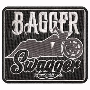 May include: Embroidered patch with the words "BAGGER Swagger" in white script and block letters. A motorcycle silhouette is in the center. The patch is black with a white border.