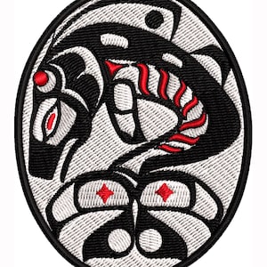May include: Embroidered patch featuring a stylized black and white design with red accents. The oval patch has a black border and depicts a creature with intricate patterns. The design includes red diamond shapes and curved lines.
