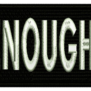 May include: White embroidered patch on a black background with the word "ENOUGH!" in white.