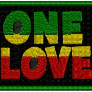 May include: Embroidered patch with the words "ONE LOVE" in green, yellow, and red. The text is on a black background, framed by a green border. The patch has a textured, stitched appearance.