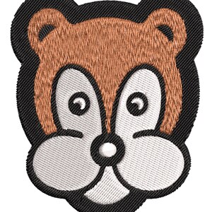 May include: Embroidered patch of a cartoon animal face with brown fur, white muzzle, and black eyes. The animal has large, round ears and a small, round nose.