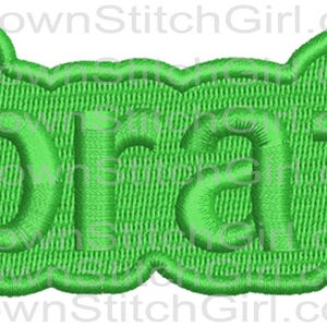 May include: Green embroidered patch with the word "brat" in a bubble-like font.
