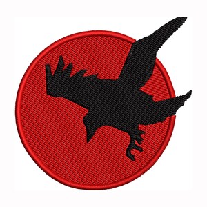 May include: Embroidered patch featuring a black raven silhouette in flight against a red circular background. The raven is detailed with outstretched wings and a downward gaze, set on a textured, stitched fabric.