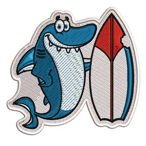 May include: Embroidered patch featuring a cartoon shark in shades of blue, holding a surfboard. The surfboard is red and white with a blue outline. The patch has a white border and is designed for apparel or accessories.