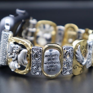 May include: Gold and silver watch band with a charm that says "angels are watching over you".