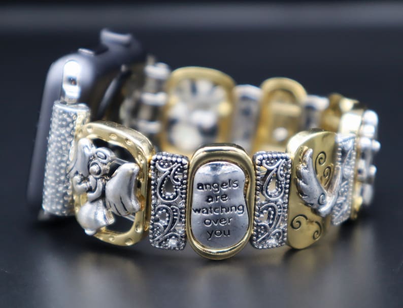 May include: Gold and silver watch band with a charm that says "angels are watching over you".