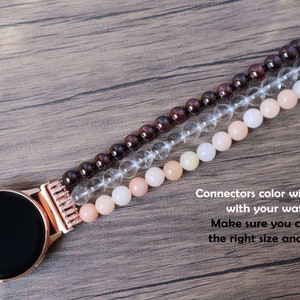 May include: A rose gold watch band with a crystal, garnet, and peach-colored stone design. Connectors color will match with your watch. Make sure you choose the right size and color.