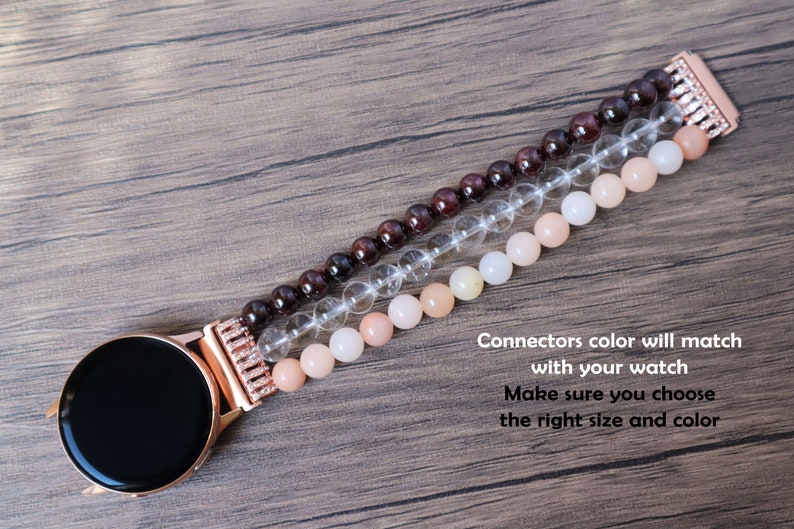 May include: A rose gold watch band with a crystal, garnet, and peach-colored stone design. Connectors color will match with your watch. Make sure you choose the right size and color.
