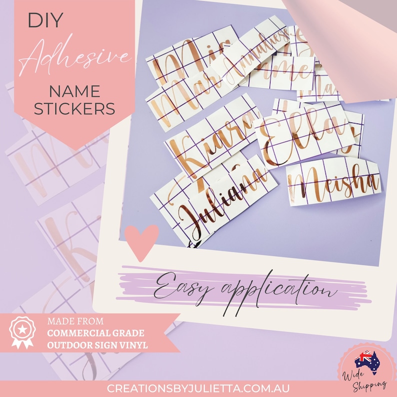 May include: A collection of rose gold metallic adhesive name stickers featuring various names like Juliana, Kiara, Ella, and Meisha. The stickers are presented on a white grid transfer paper, arranged on a light purple background with text overlays.