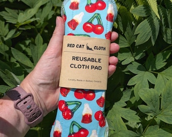 Reusable cloth pads in Cherry Cola pique print, washable menstrual cloth pads for a zero waste period