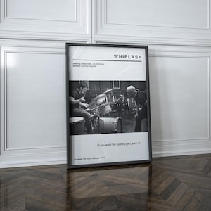 May include: Black and white framed movie poster for the film "Whiplash." The poster features a scene of a drummer and a conductor. Text includes the film title, credits, and the quote "If you want the fucking part, earn it!"