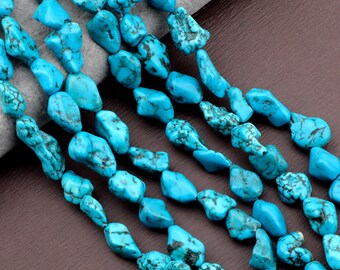 May include: Strands of turquoise gemstone beads. The beads are a vibrant turquoise color with dark matrix patterns. The irregular, nugget-like shapes are strung together, creating a natural and textured appearance. Ideal for jewelry making.