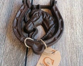 Horse head horse shoe door knocker