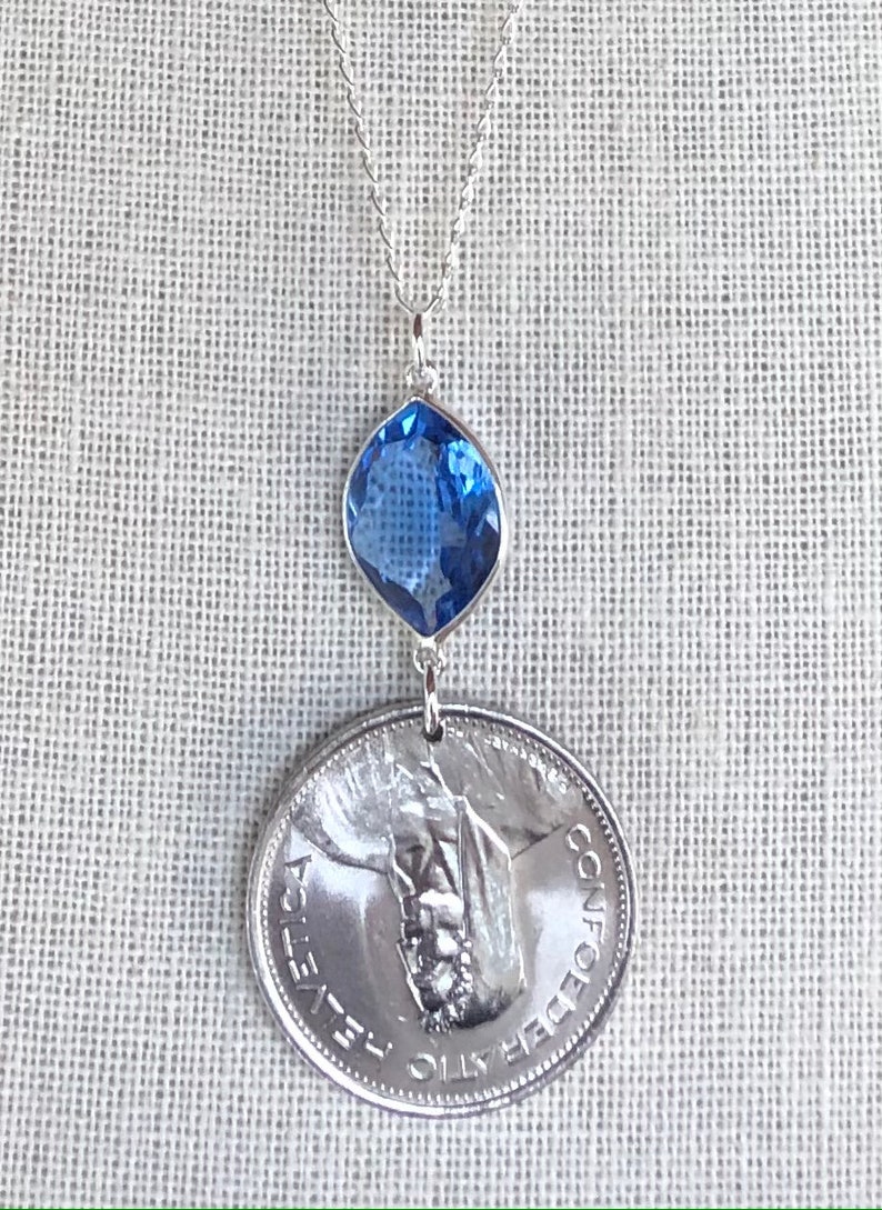 Swiss escutcheon with flower wreaths. Vintage 1968 Switzerland 5 Franc Coin with Tanzanite on 26\u201d Sterling Silver Necklace