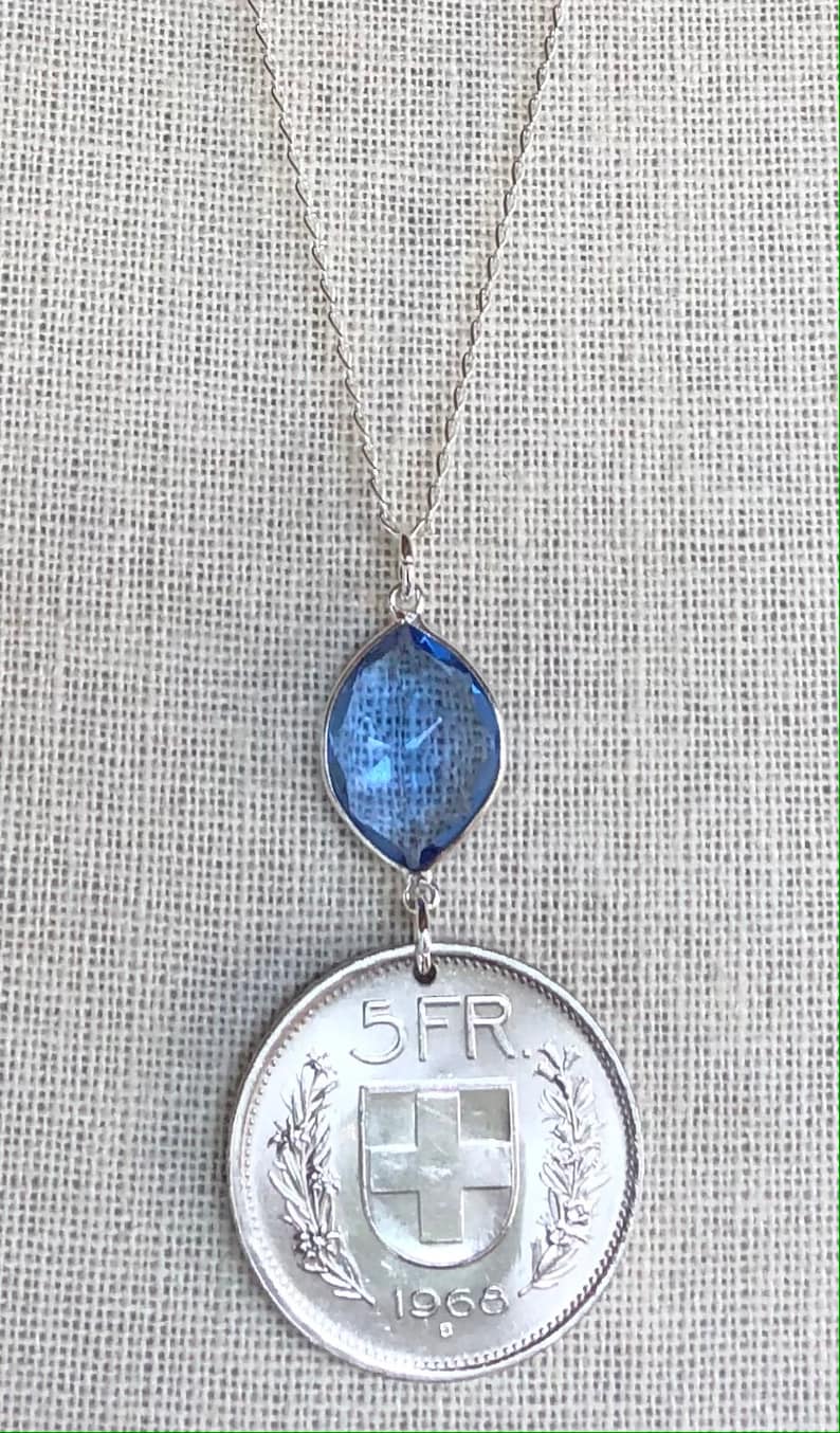 Swiss escutcheon with flower wreaths. Vintage 1968 Switzerland 5 Franc Coin with Tanzanite on 26\u201d Sterling Silver Necklace