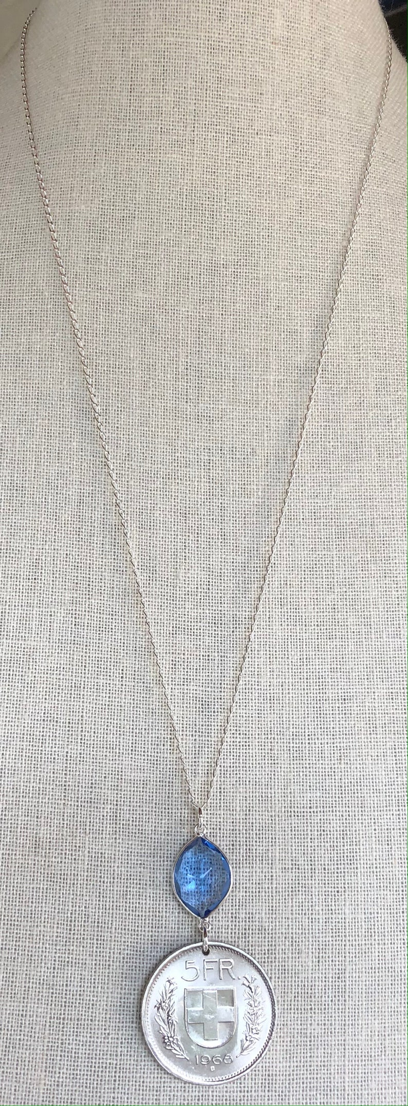Swiss escutcheon with flower wreaths. Vintage 1968 Switzerland 5 Franc Coin with Tanzanite on 26\u201d Sterling Silver Necklace