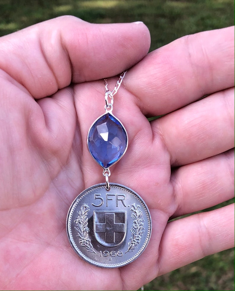 Swiss escutcheon with flower wreaths. Vintage 1968 Switzerland 5 Franc Coin with Tanzanite on 26\u201d Sterling Silver Necklace