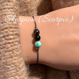 Skorpion Skorpion Bransoletka ze znakiem zodiaku • Bransoletka z kamieni szlachetnych • Hematyt Obsydianowy turkus • Bransoletka szczęścia • Wypełniona 14-karatowym złotem • Srebro 925