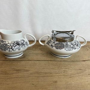 Vintage Large White and Black Wildwood Milk Jug and Sugar Bowl Sugar has metal lid attached with integral spoon in Good Condition.