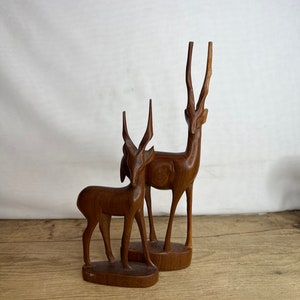 Vintage Pair of Hardwood Hand Carved Antelope Figure / Ornament. Both sit to the same side. Good Condition