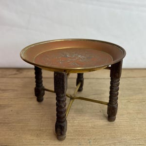 Vintage Brass Chinese Design Circular Dish On A Folding Wooden Stand. Good Condition