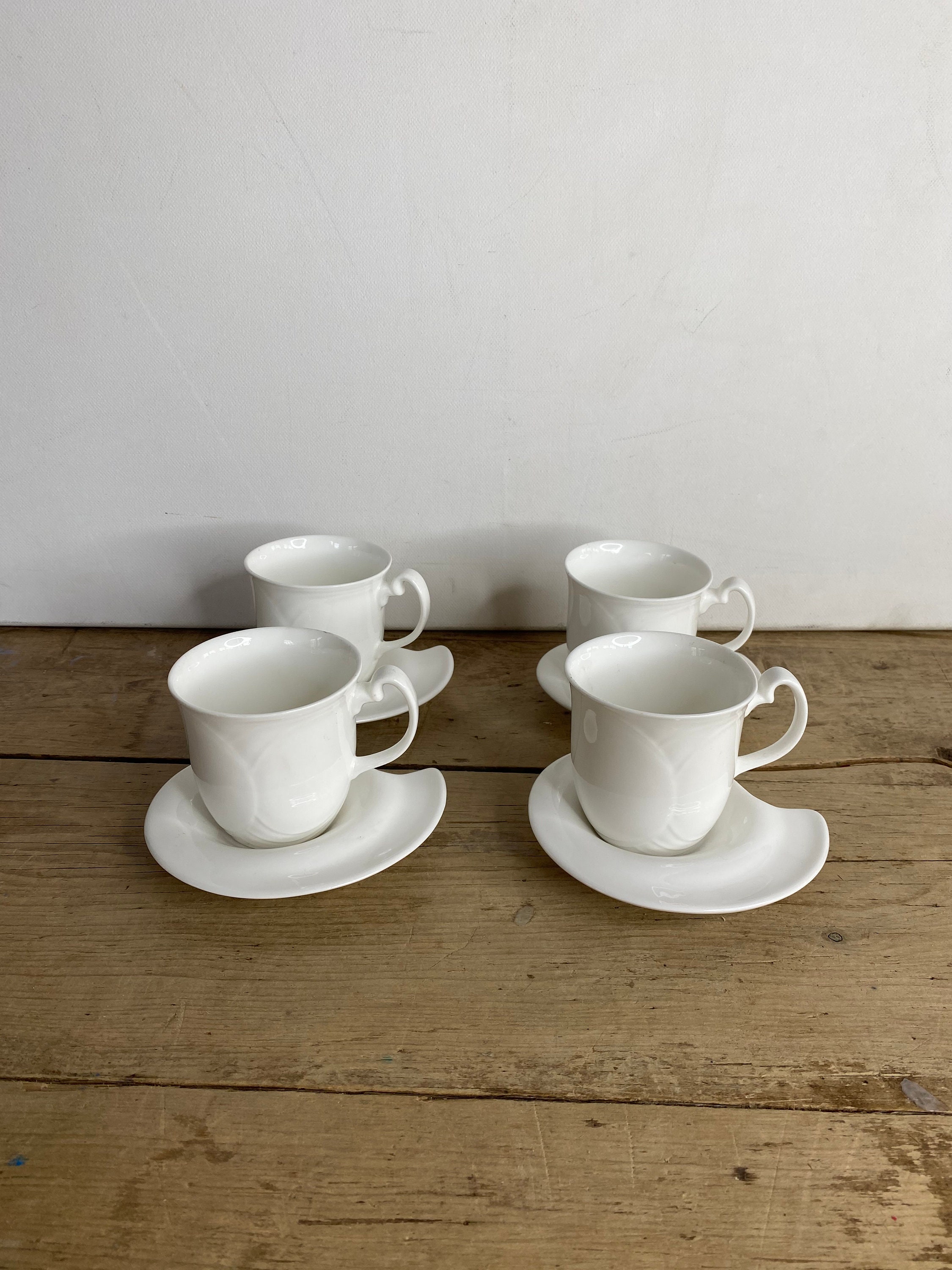 White Empty Tea Cup And Saucer With Simple Pattern Isolated On