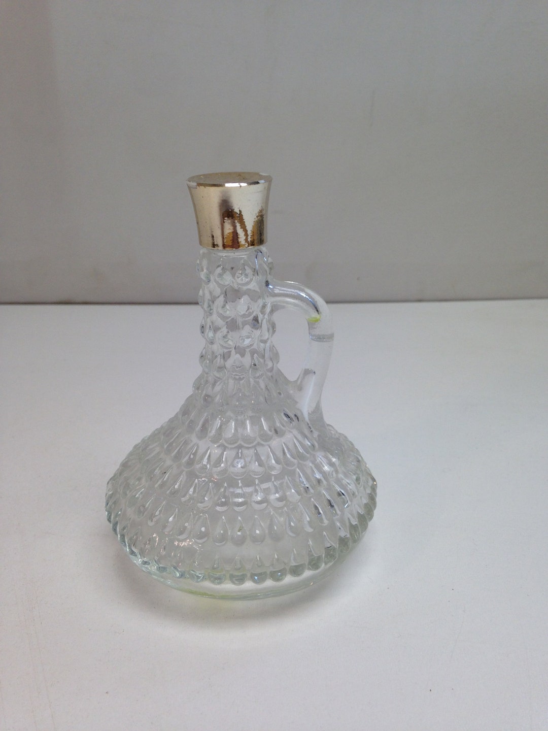 Vintage Glass Vinegar Bottle / Dressing Jug Teardrop Embossed With Silver Colour Plastic Lid