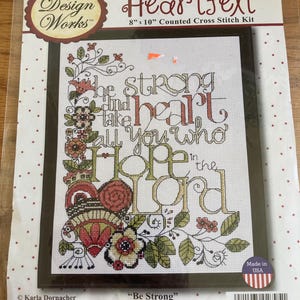 May include: A "Heartfelt" counted cross stitch kit, 8" x 10", featuring the text "Be Strong" and "Hope in the Lord". The design includes floral and leaf accents in red, green, and white. Made in the USA.