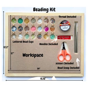 May include: A wooden beading kit with a workspace, 26 lettered bead cups, needles, thread, scissors, and a bead scoop. The kit measures 38.5 cm wide by 31 cm tall.