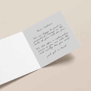 May include: An open greeting card with a gray interior panel and white exterior. The gray panel features handwritten text that reads, "Dear Customer, We are happy to print a personalized message...just get in touch."